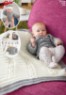 Bild på Stickmönster till babytröja, mössa med tofs och filt i Junior eller Elise