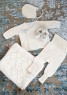 Bild på "HENTESETT" stick set för baby design Leila Hafzi i Alpakka Silke