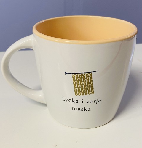 Bild på "Lycka i varje maska" kaffe mugg 