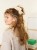 Bild på "FLEUR SCRUNCHIE" stickad i Tynn Silk Mohair 2502-11