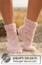 Bild på " Annie's Dance" sockor stickade i Drops Snow 129-33